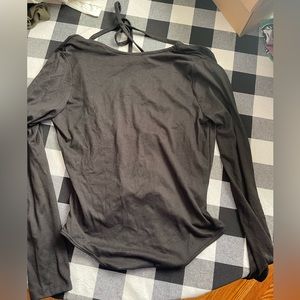 Black, backless body suit. Size L. Never worn.